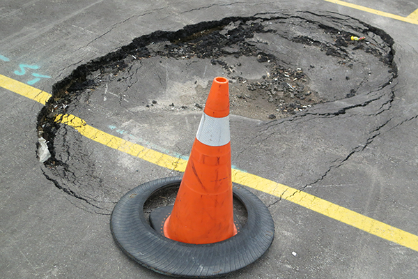 our commercial parking lot contractor can help you repair the hole on parking lots